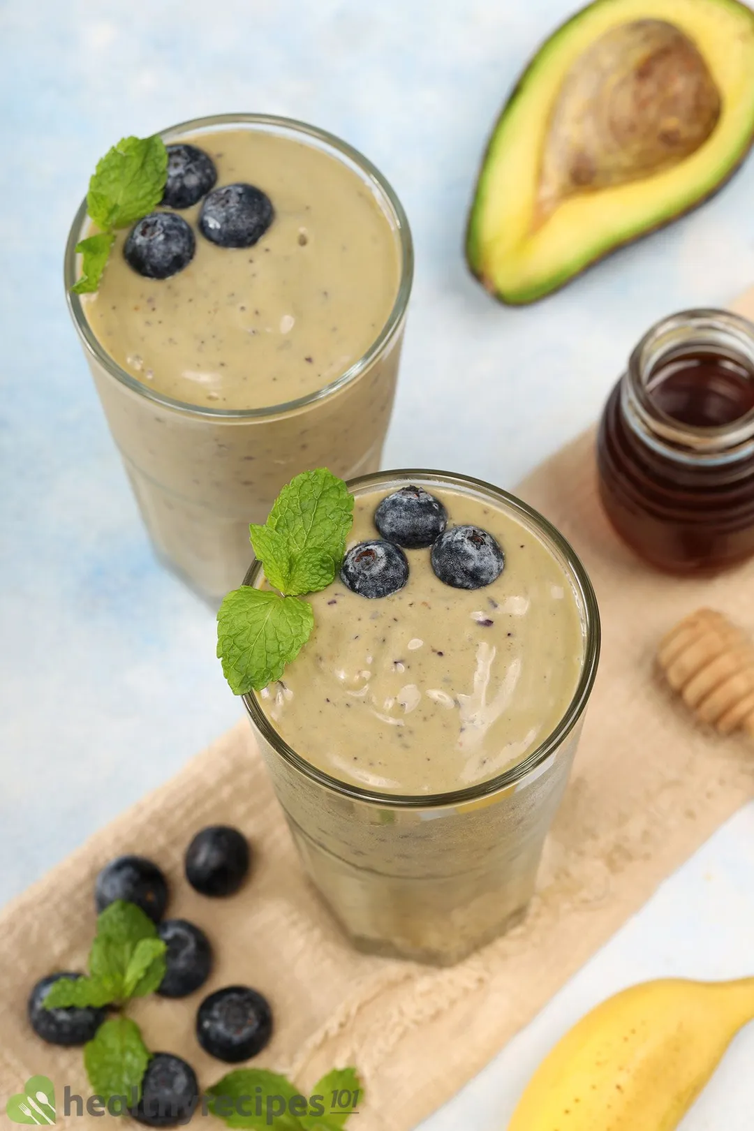 two glasses of blueberry and avocado smoothie