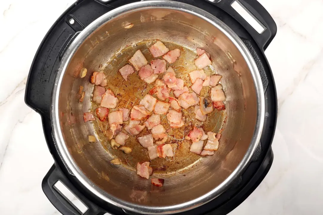 2 Saute bacon in olive oil for 1 minute