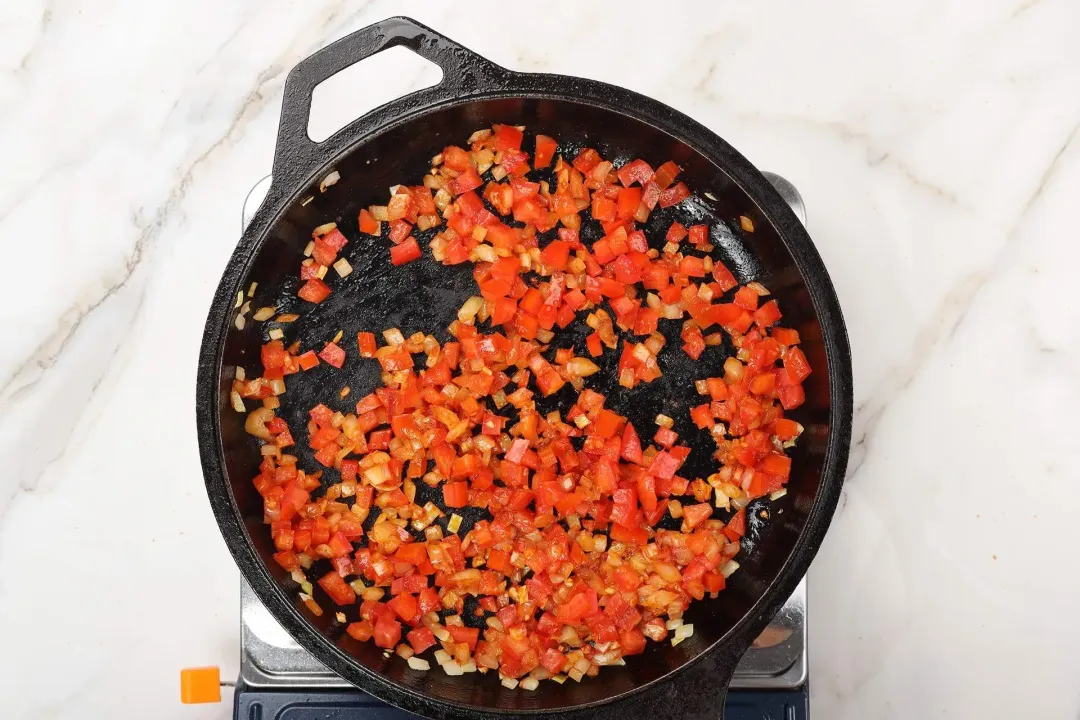 3 Add tomato paste and chopped tomatoes