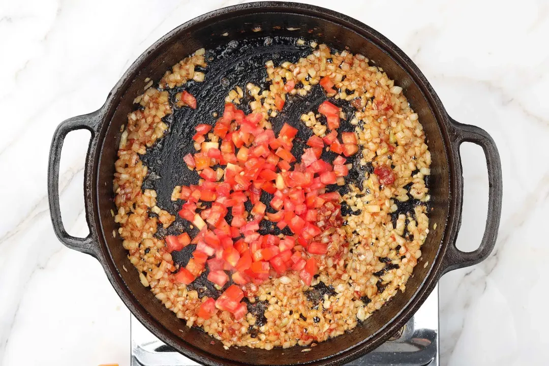 4 Add the diced tomatoes Stir with onion garlic