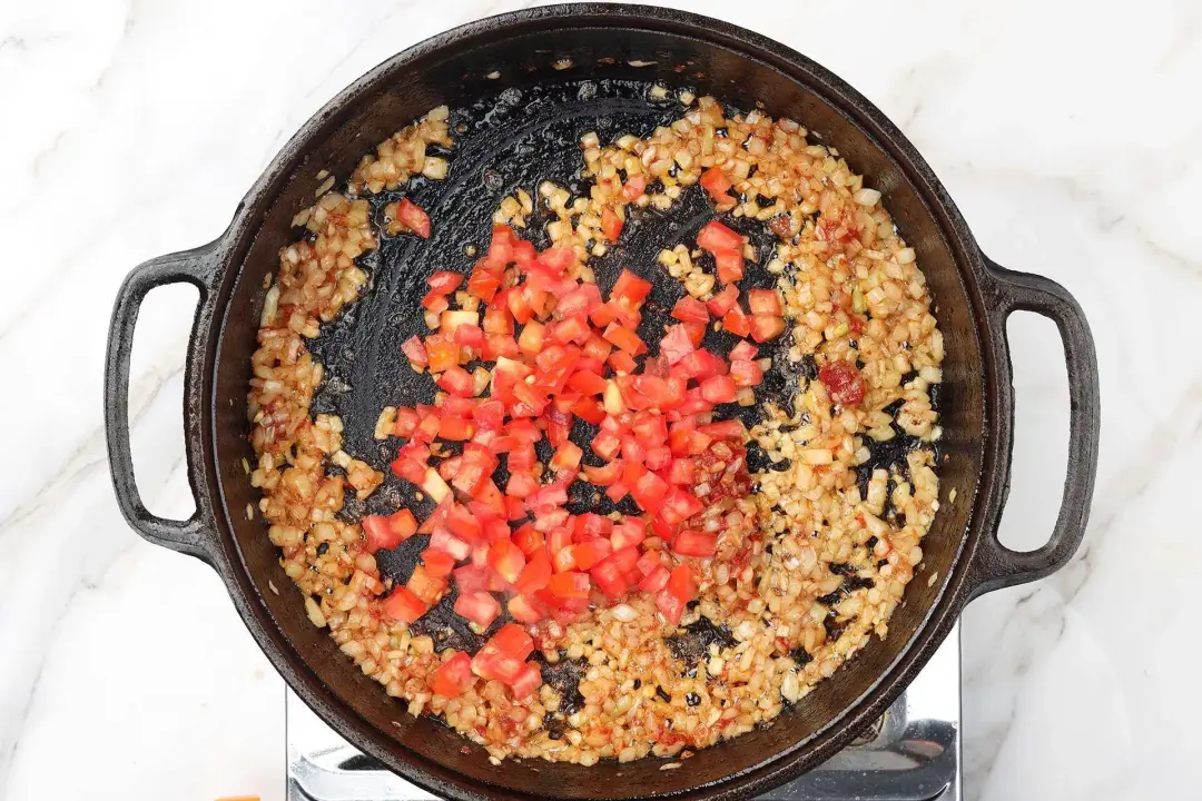 4 Add the diced tomatoes Stir with onion garlic