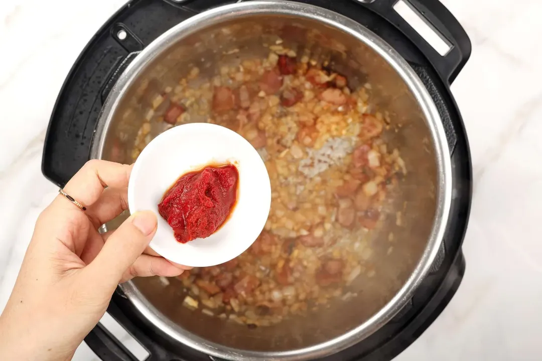 4 Add tomato paste and stir for 30 seconds