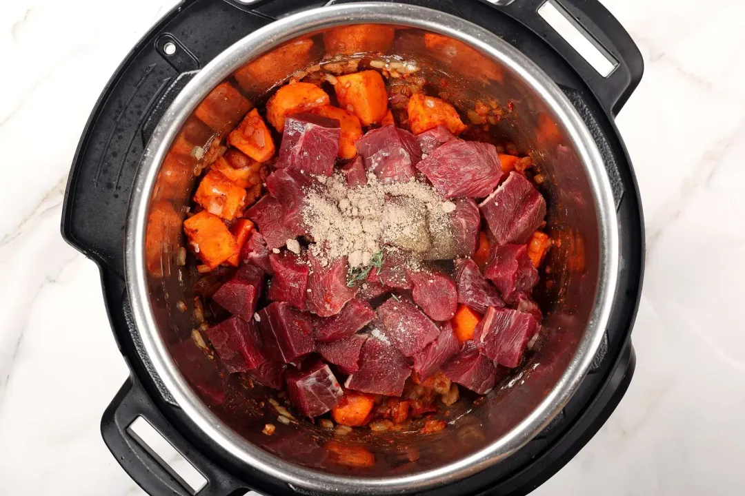 6 Add beef chuck to saute with the spices