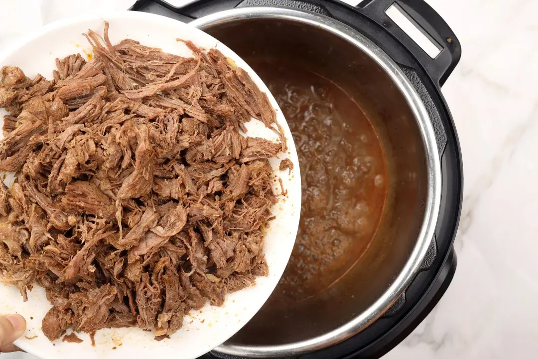 6 Cook the shredded meat in its gravy
