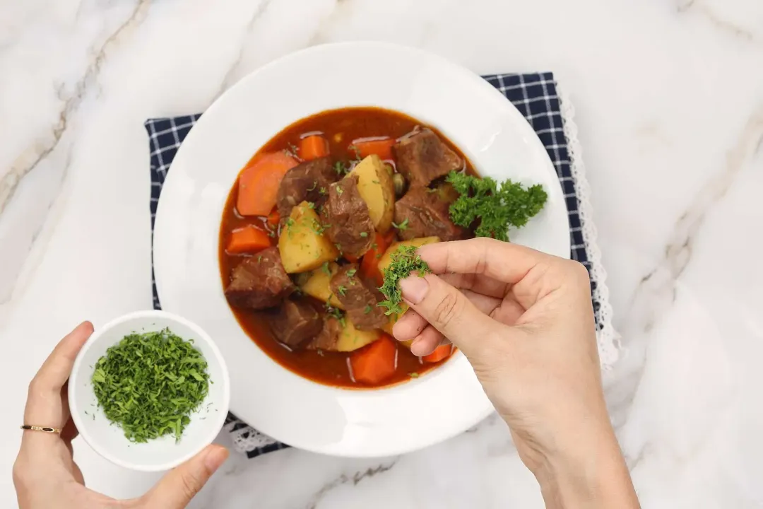 6 Garnish with parsley and serve beef stew