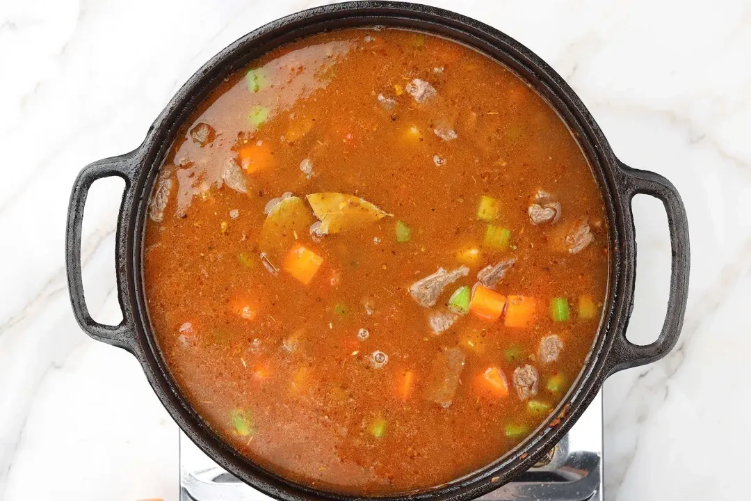 8 Stir chicken broth and simmer for 45 more minutes until the beef is tender