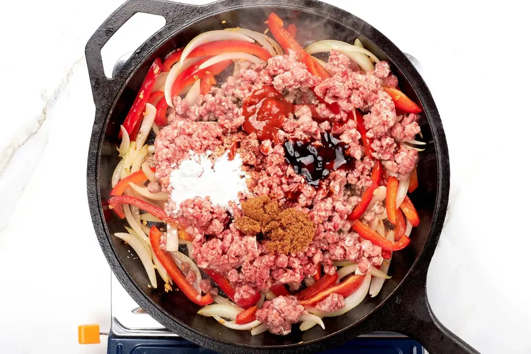 Add the ground beef to brown with the ingredients for the sauce