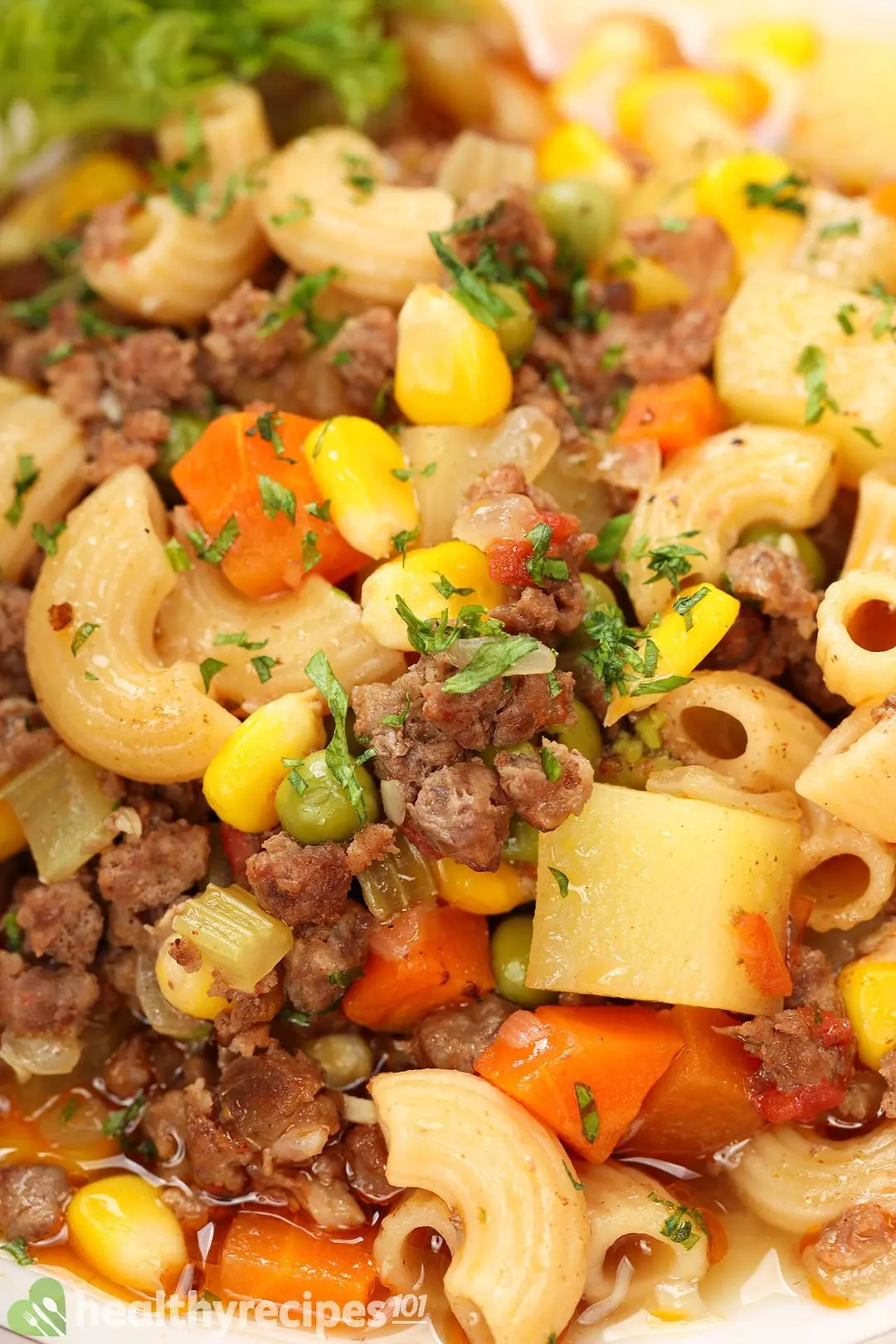 close-up shot of cooked ground beef with cubed potatoes and carrot, corn, green bean