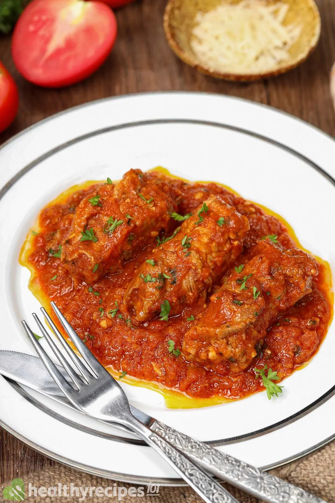 a plate of cooked beef braciole