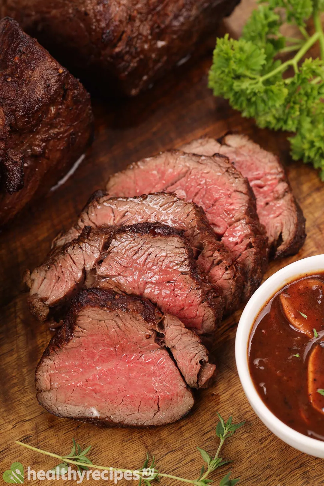 slices of roasted beef tenderloin on a cutting board