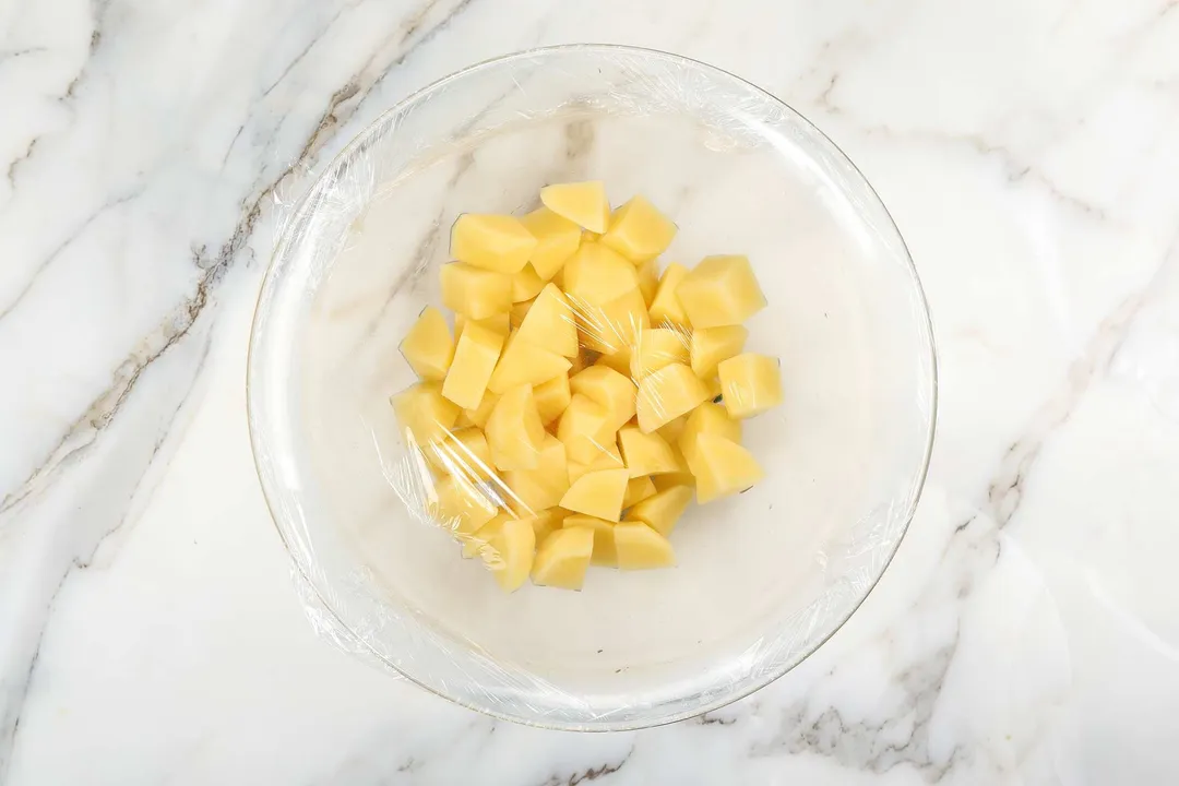 top view of potatoes cubed in a glass bowl