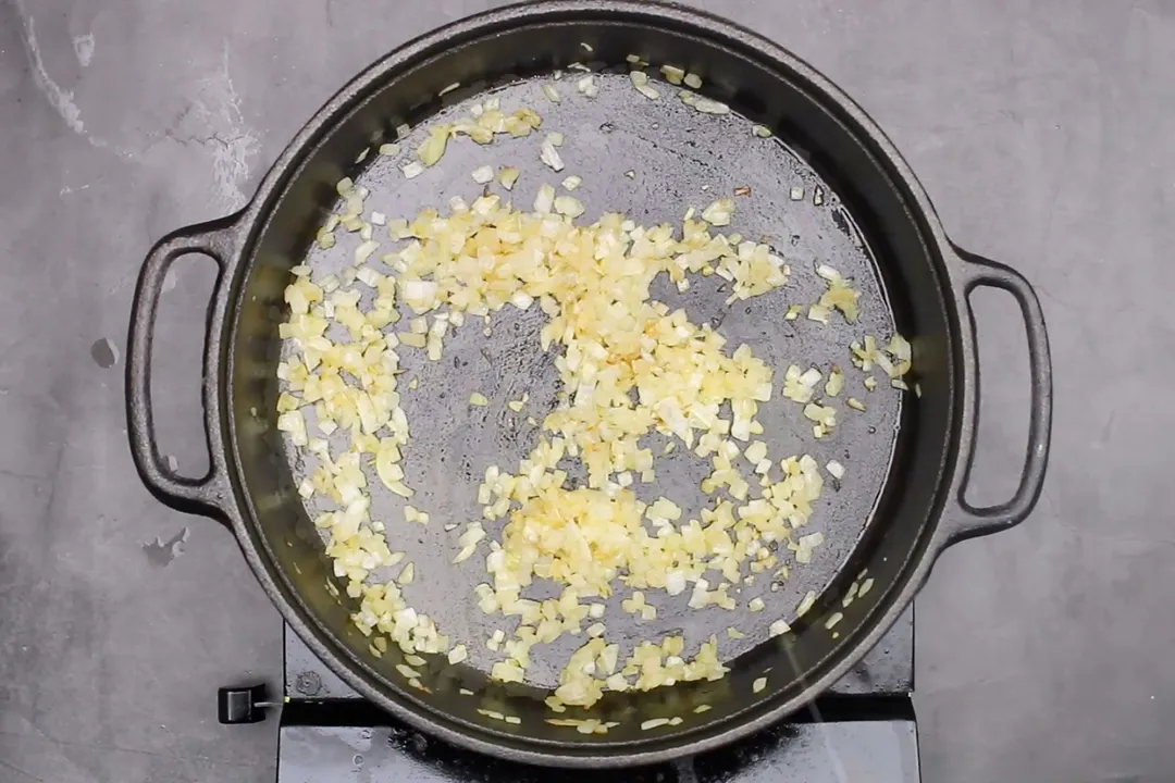 minced onion on a cast iron skillet