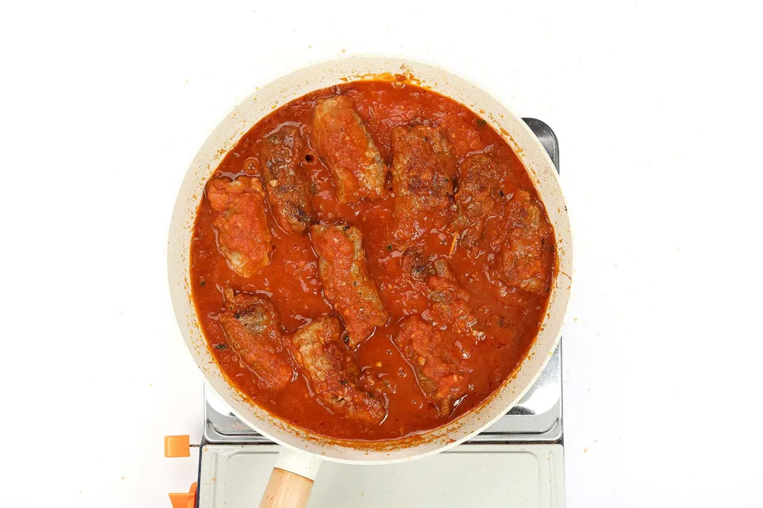 a skillet of beef braciole