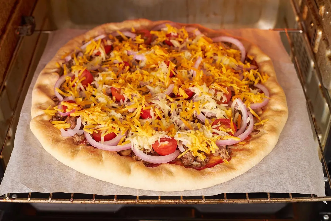 pizza baking in oven