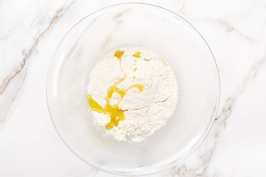 flour and yellow sauce in a glass bowl