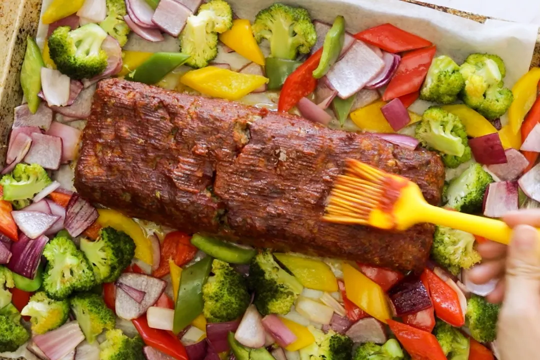 smear the glazer on top of meatloaf, surrounded by veggies