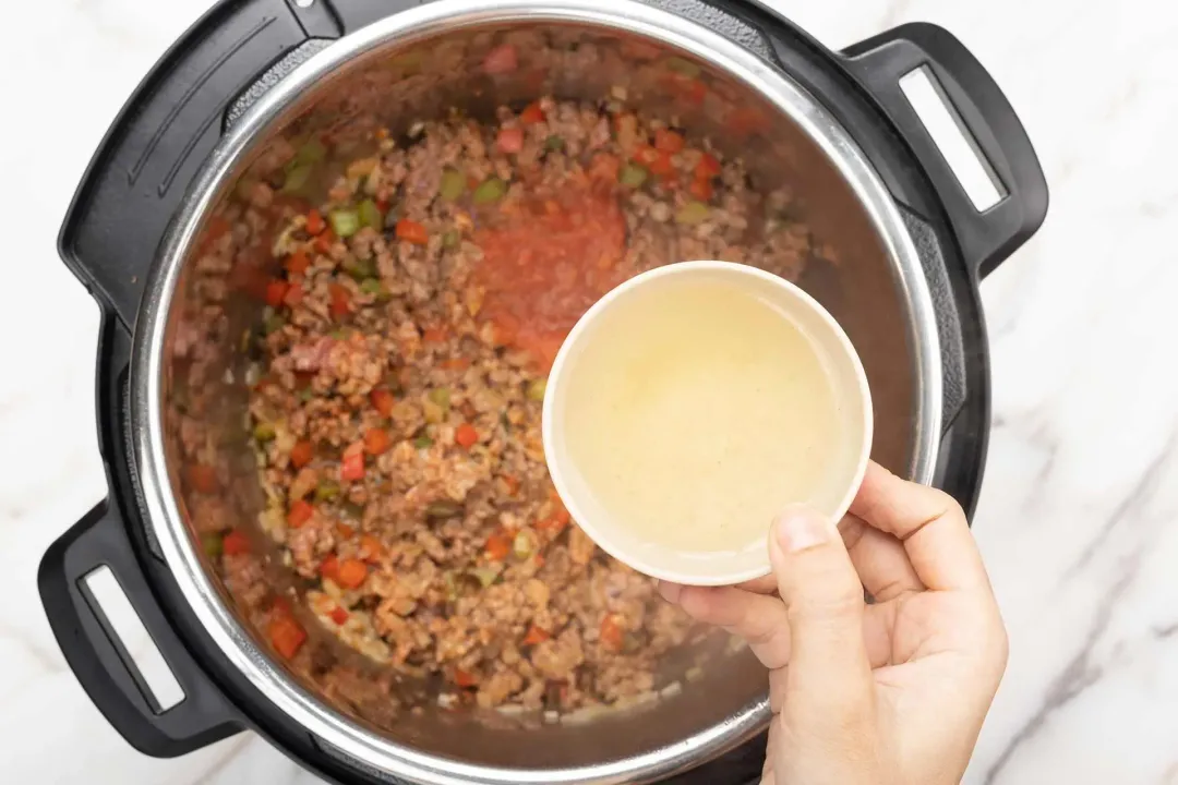 Stir in the tomato sauce and broth and pressure cook sloppy joes