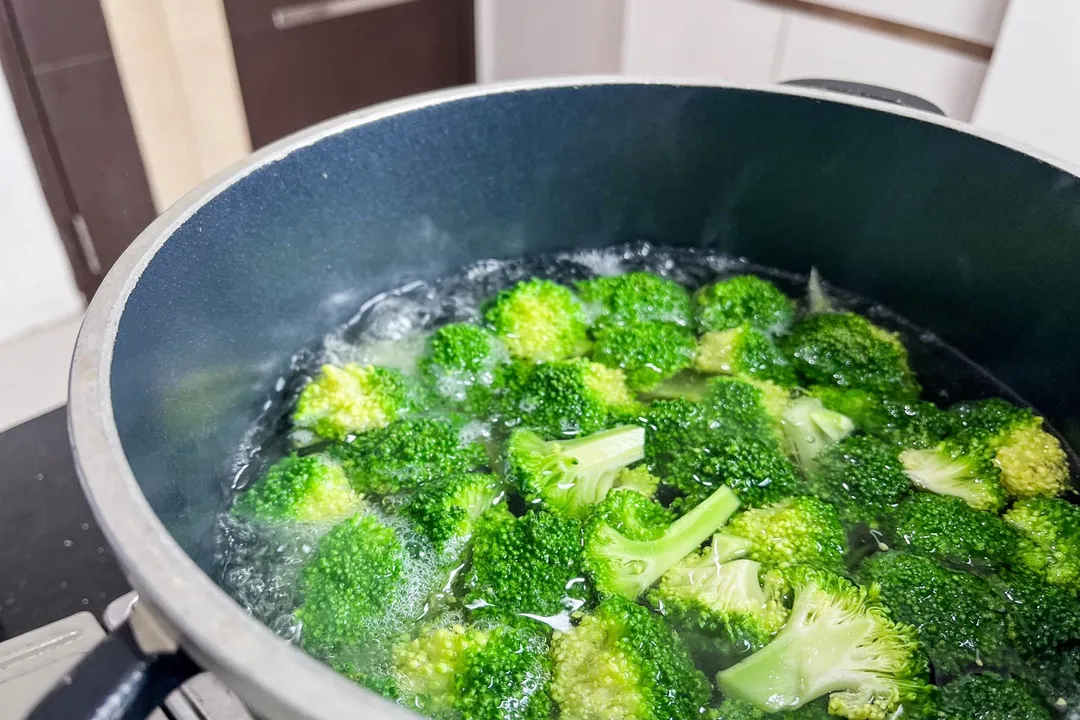 boiling broccoli florets in a pot