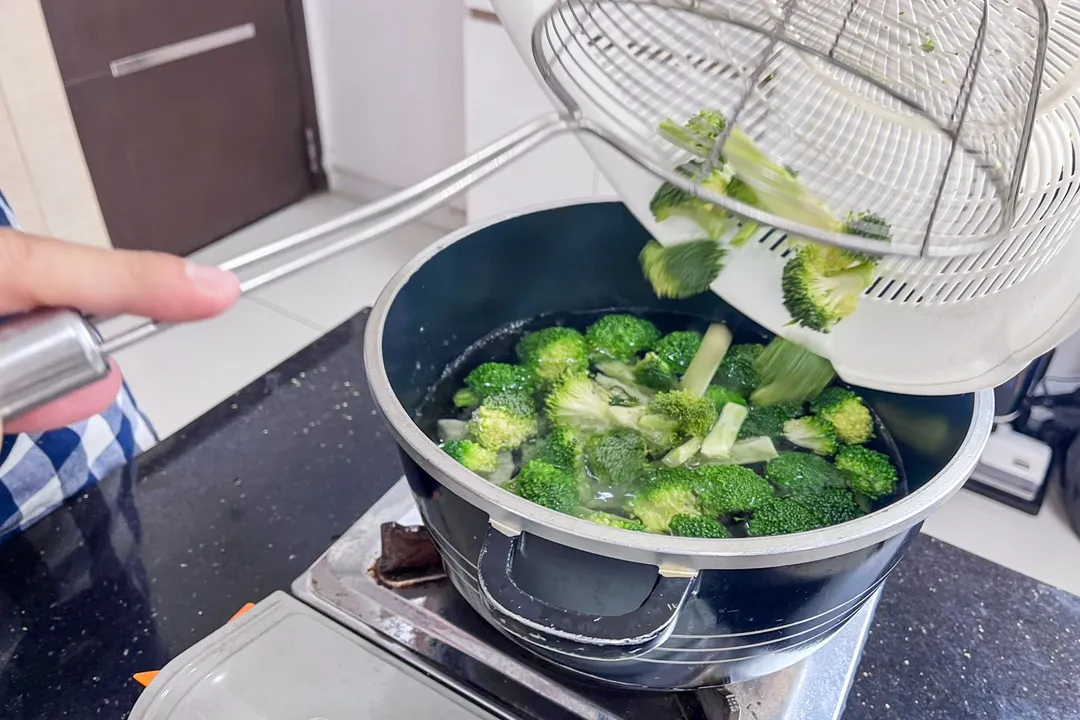 pour broccoli florets into a pot of water