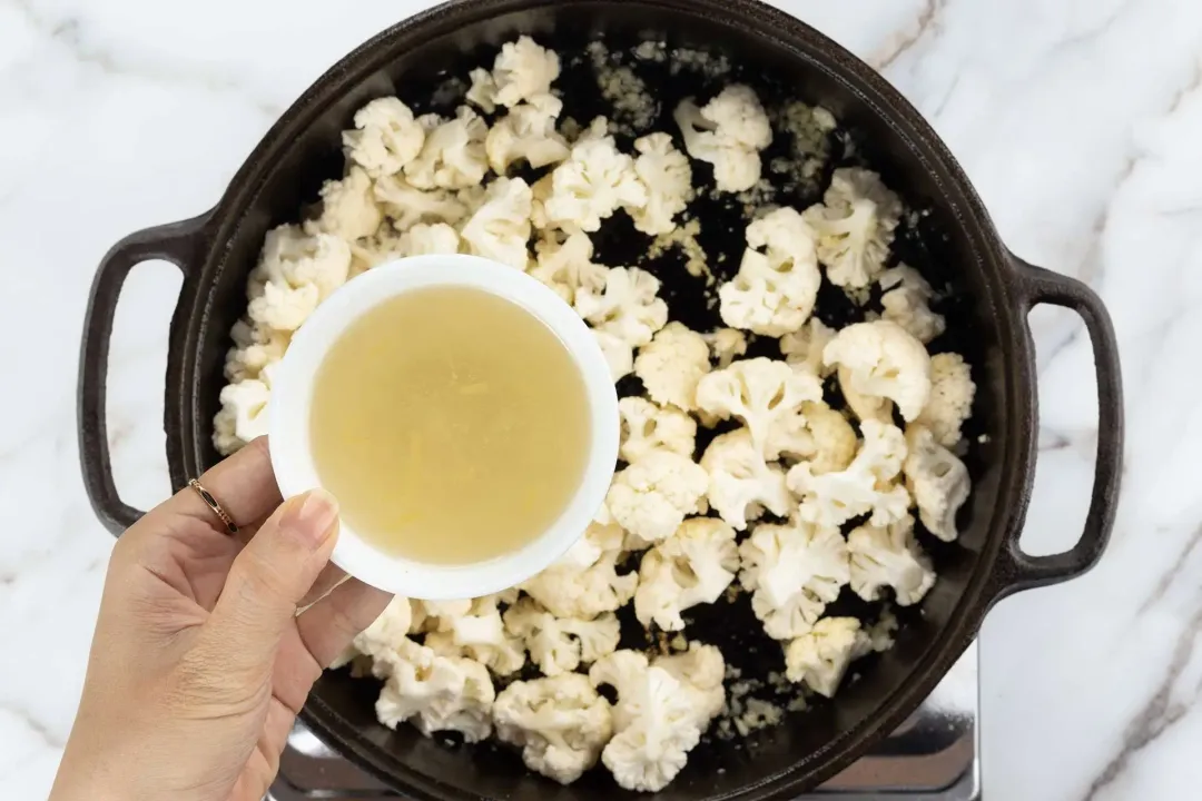 Add cauliflower and broth to cauliflower pasta