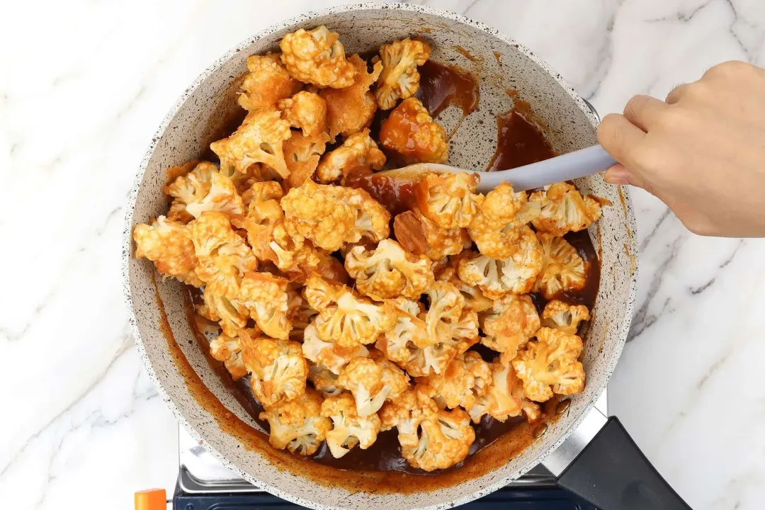 Add cauliflower to the skillet and toss with the bang bang sauce