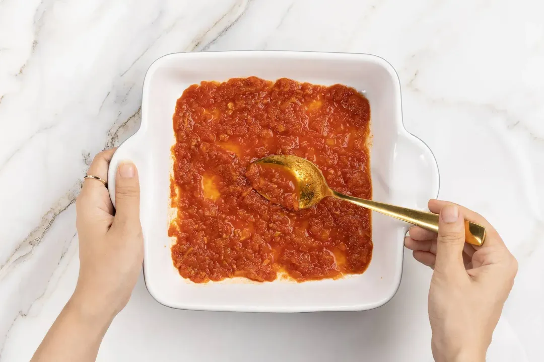 Add tomato sauce to the baking dish