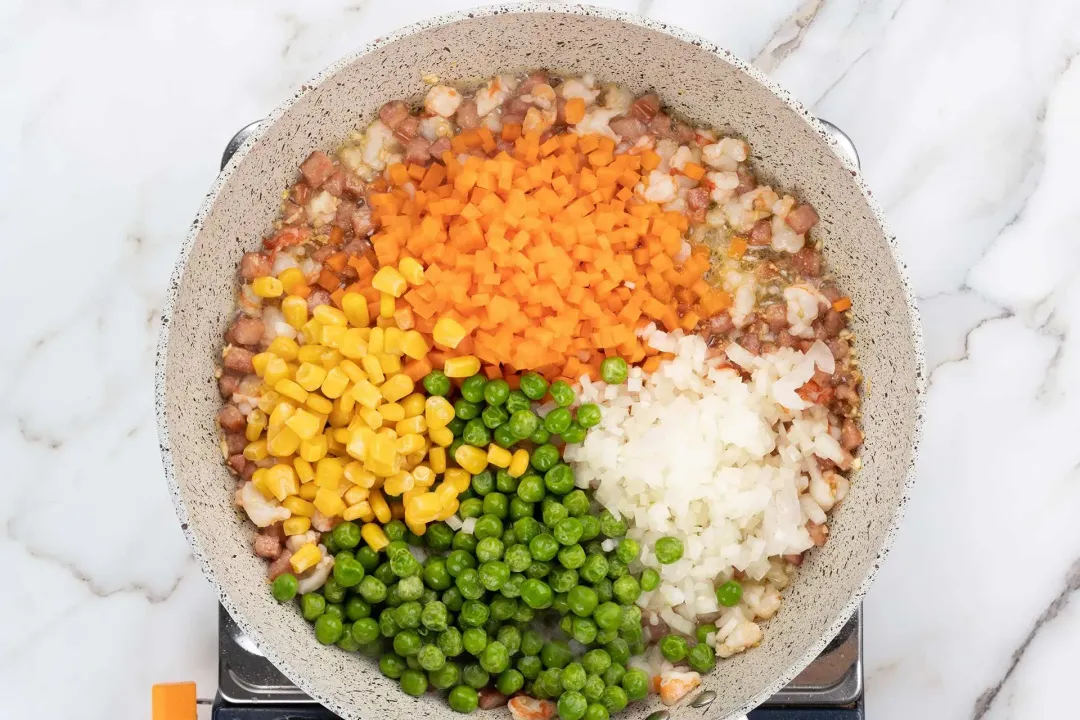 Add the vegetables for cauliflower rice