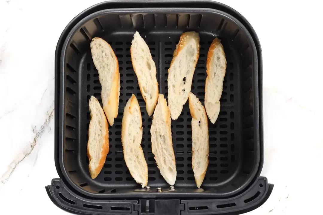 In the air fryer toast the baguette slices