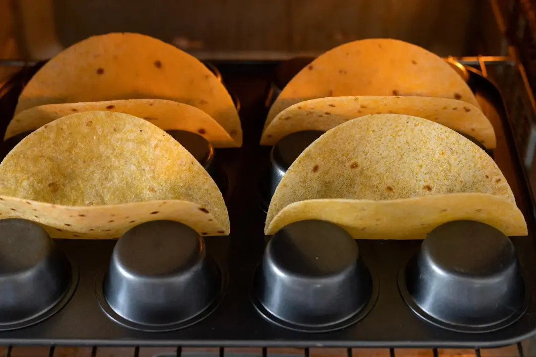Bake the tortillas for buffalo cauliflower tacos