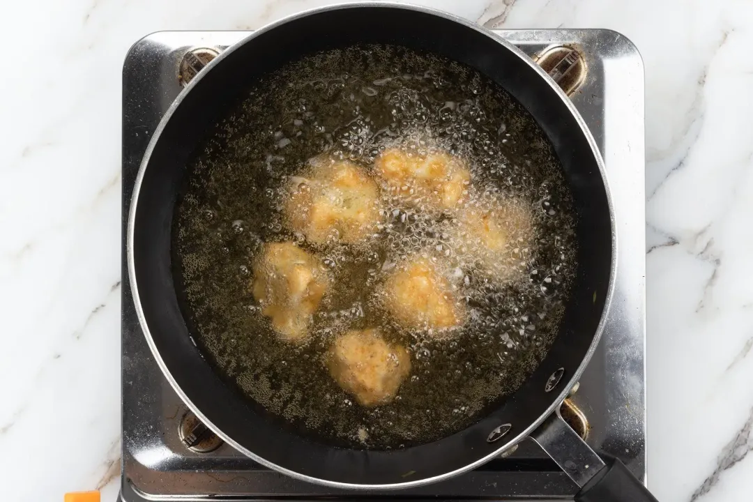 Deep fry the cauliflower florets until crispy golden