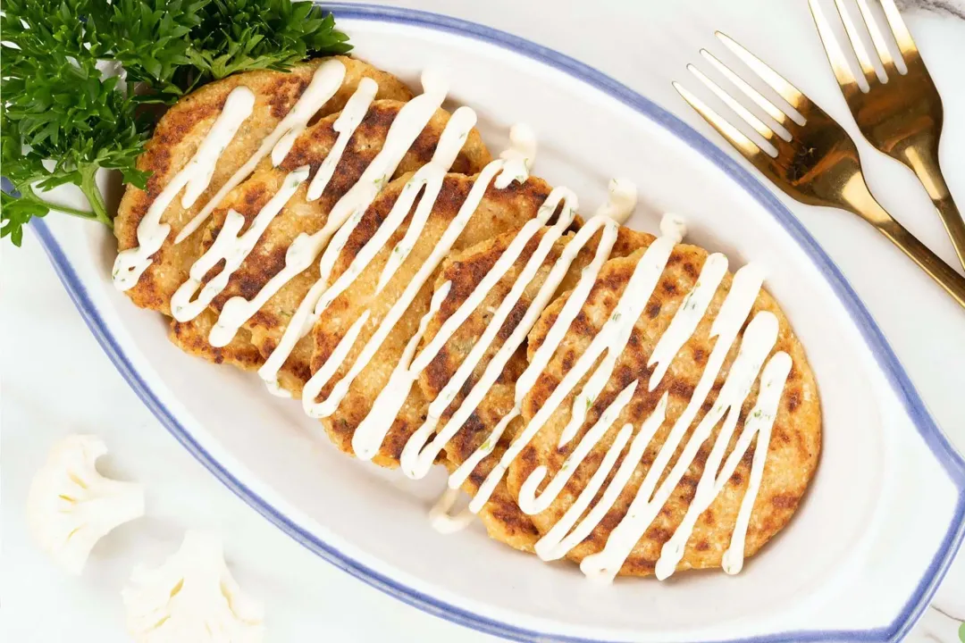 Enjoy the cauliflower hash browns hot with the mayo dipping sauce