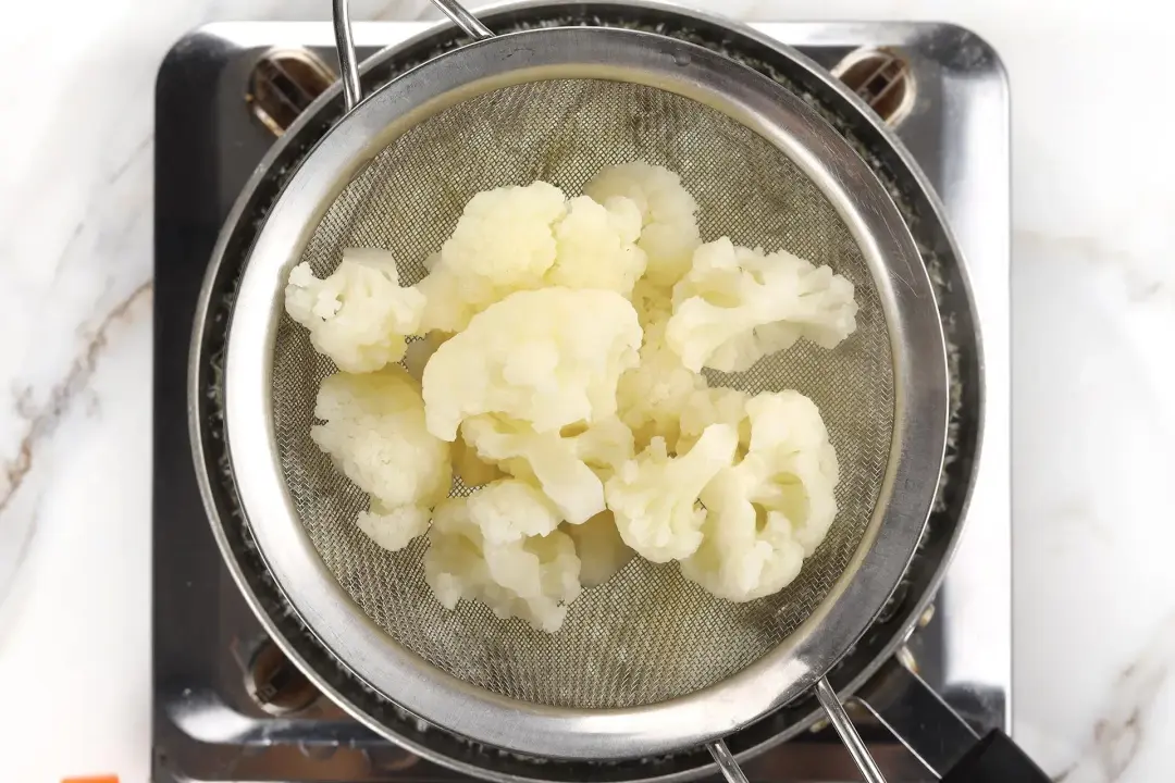 Remove the cauliflower Drain and set aside
