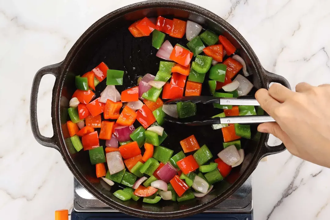 Saute the peppers for cauliflower kung pao