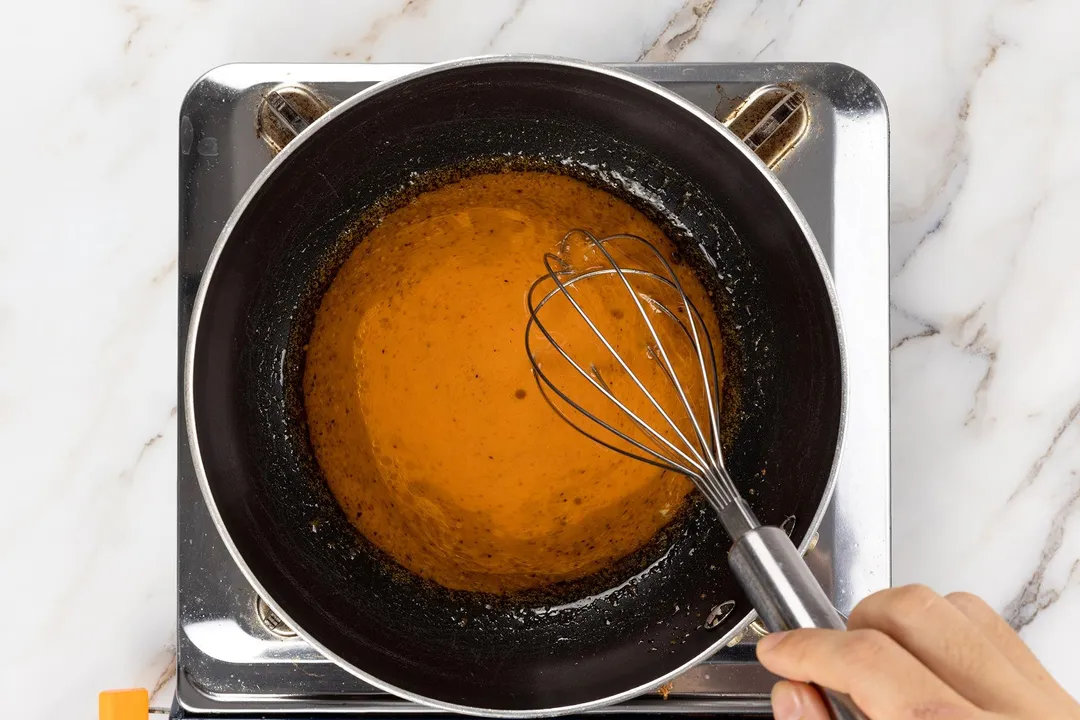 cooking sauce in a skillet