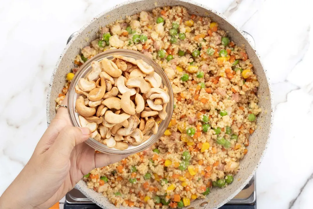 Stir in the cashew nuts for cauliflower rice