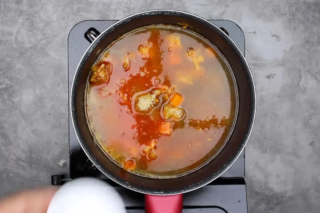 4 Add broth and simmer thai chicken curry