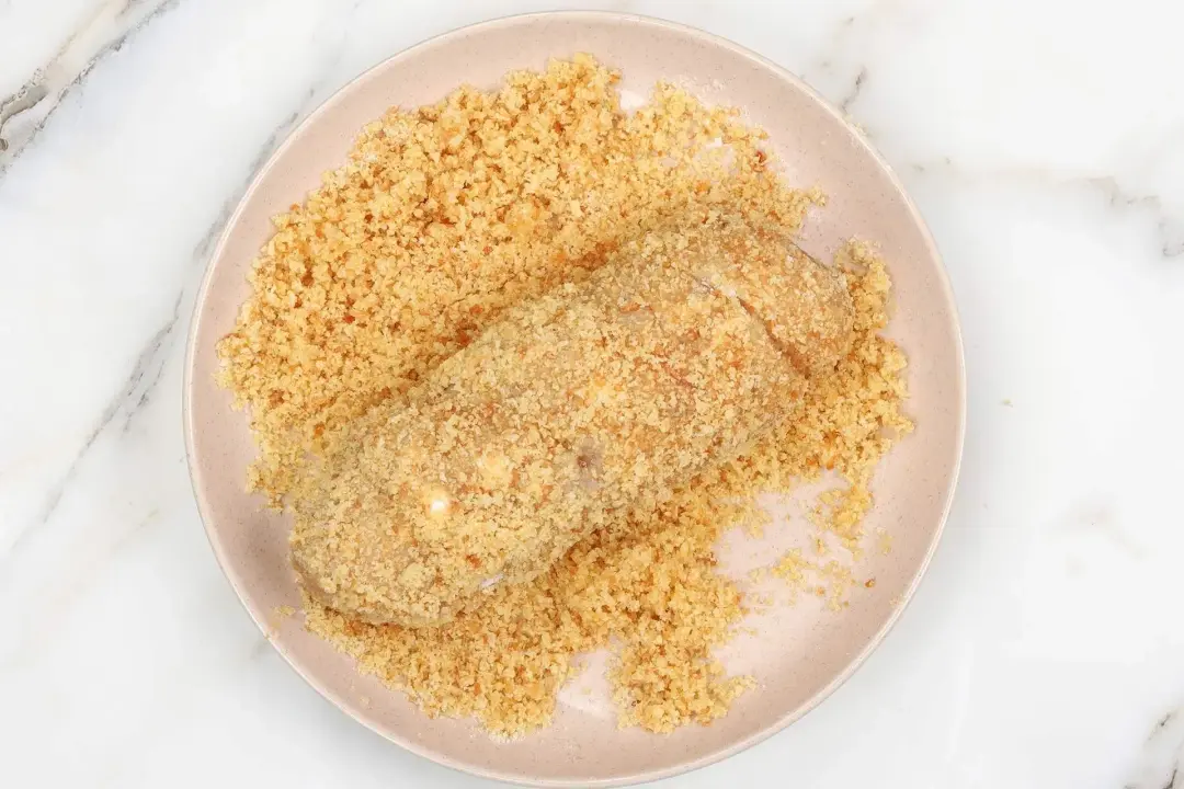 7 transfer the coated chicken roll to breadcrumbs and butter