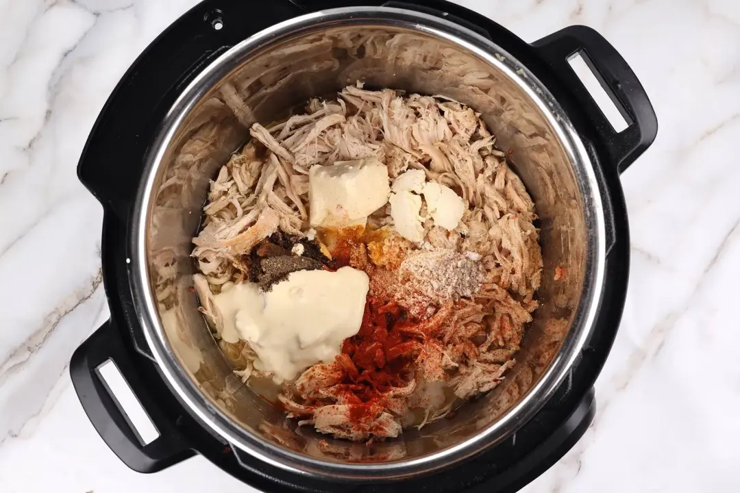 Add the milk and seasoning to crack chicken