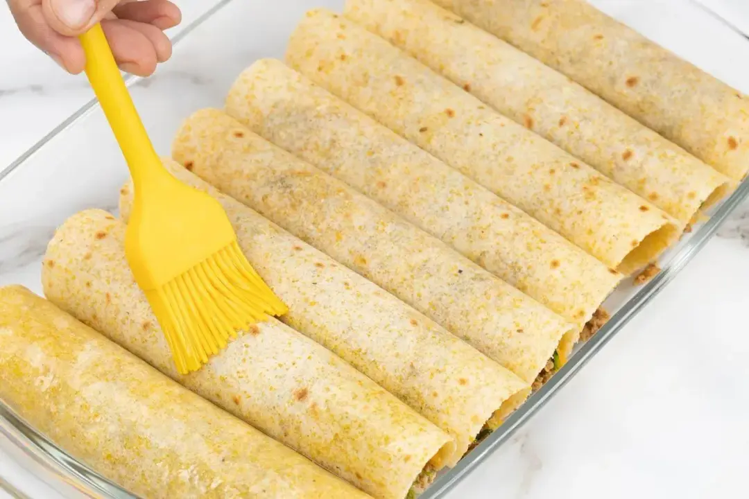 Brush olive oil on top for chicken taquitos