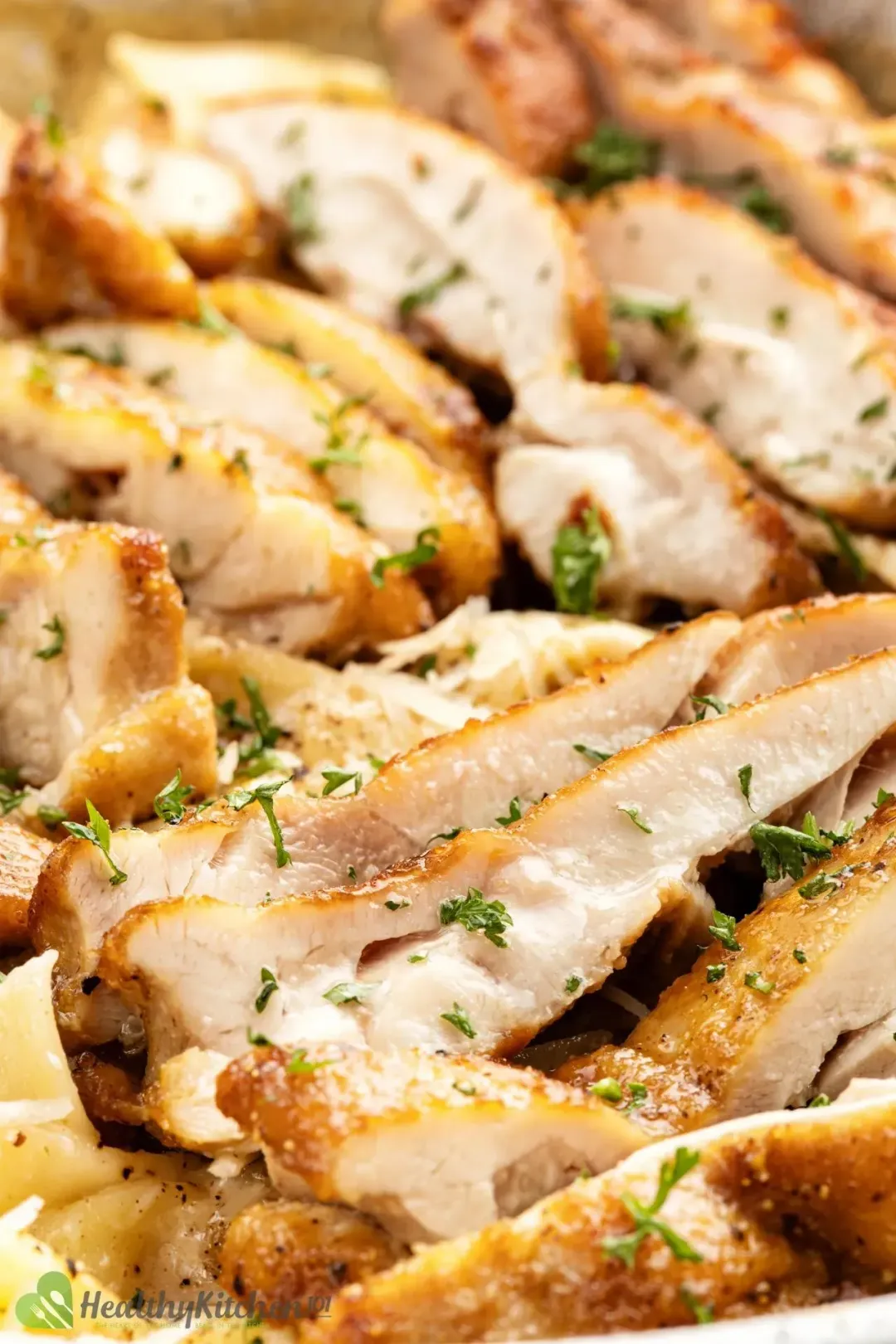 A close up of chicken slices with brown exterior and white meat