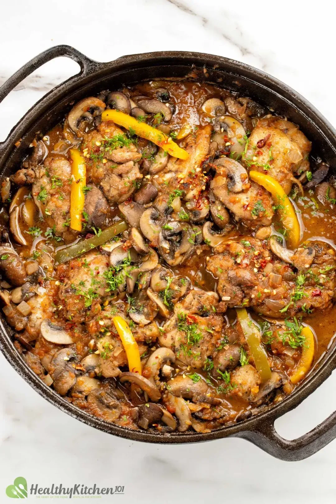 A skillet filled with Chicken Cacciatore