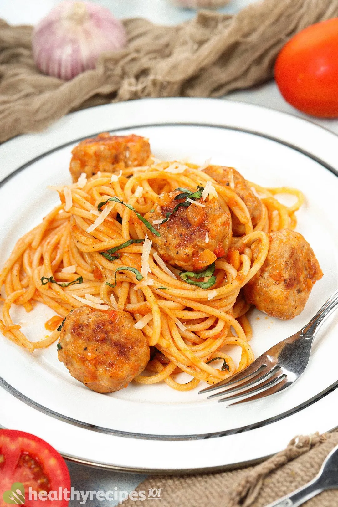 A plate of chicken meatballs served with spaghetti