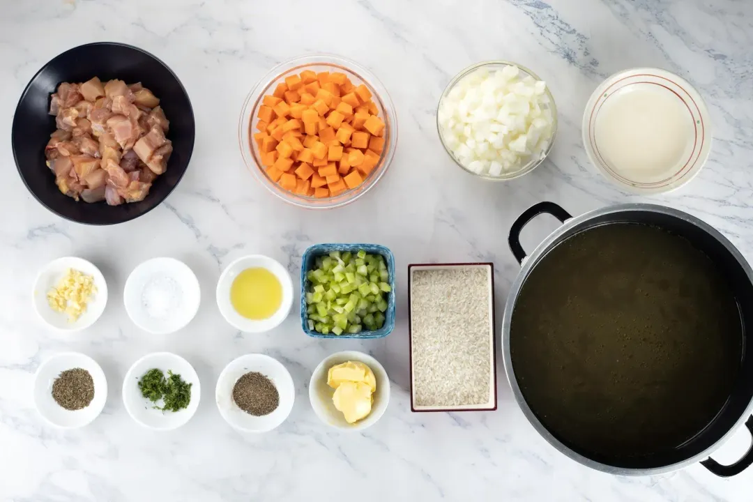 Ingredients: cubed chicken, cubed carrots, chopped celery, chopped white onion, and other ingredients contained in bowls