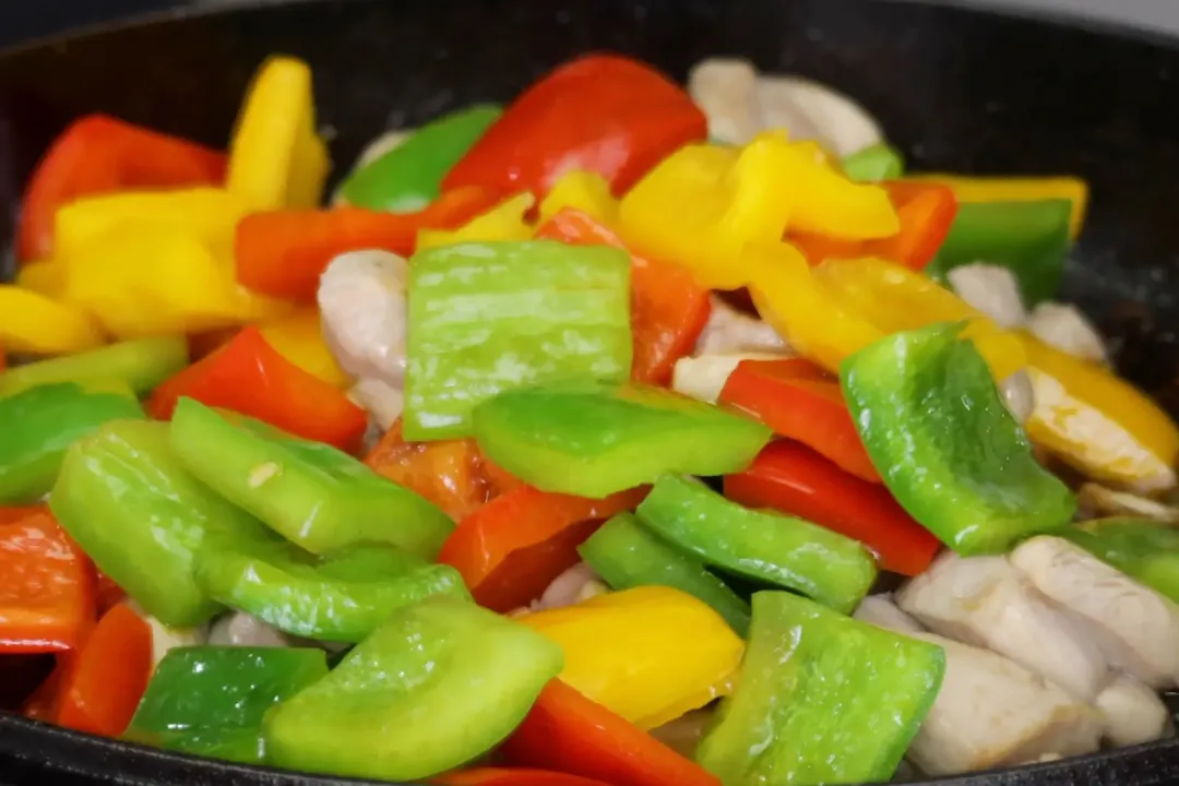Combine chicken and veggies with sauce for kung pao