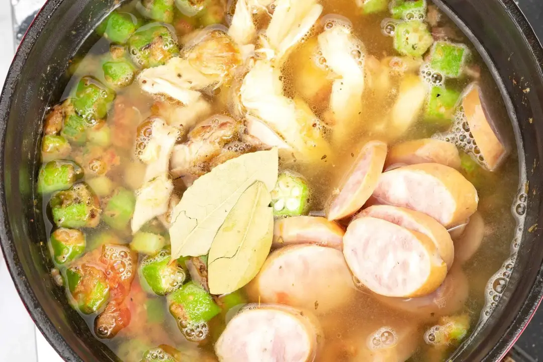 Cook the chicken and sausage gumbo