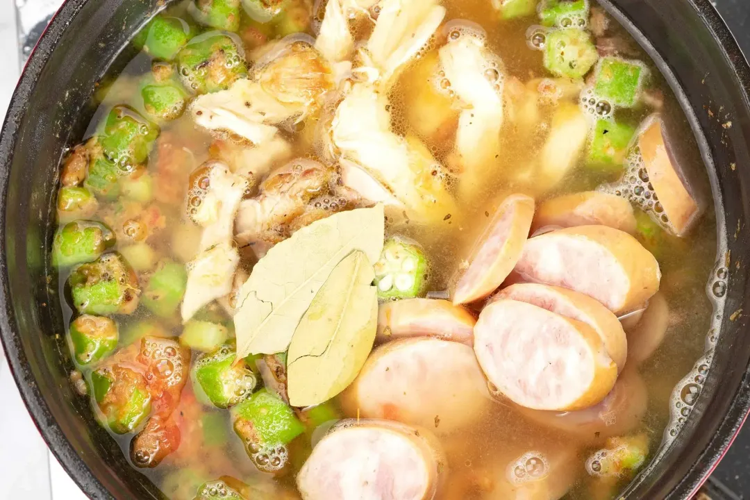 Cook the chicken and sausage gumbo