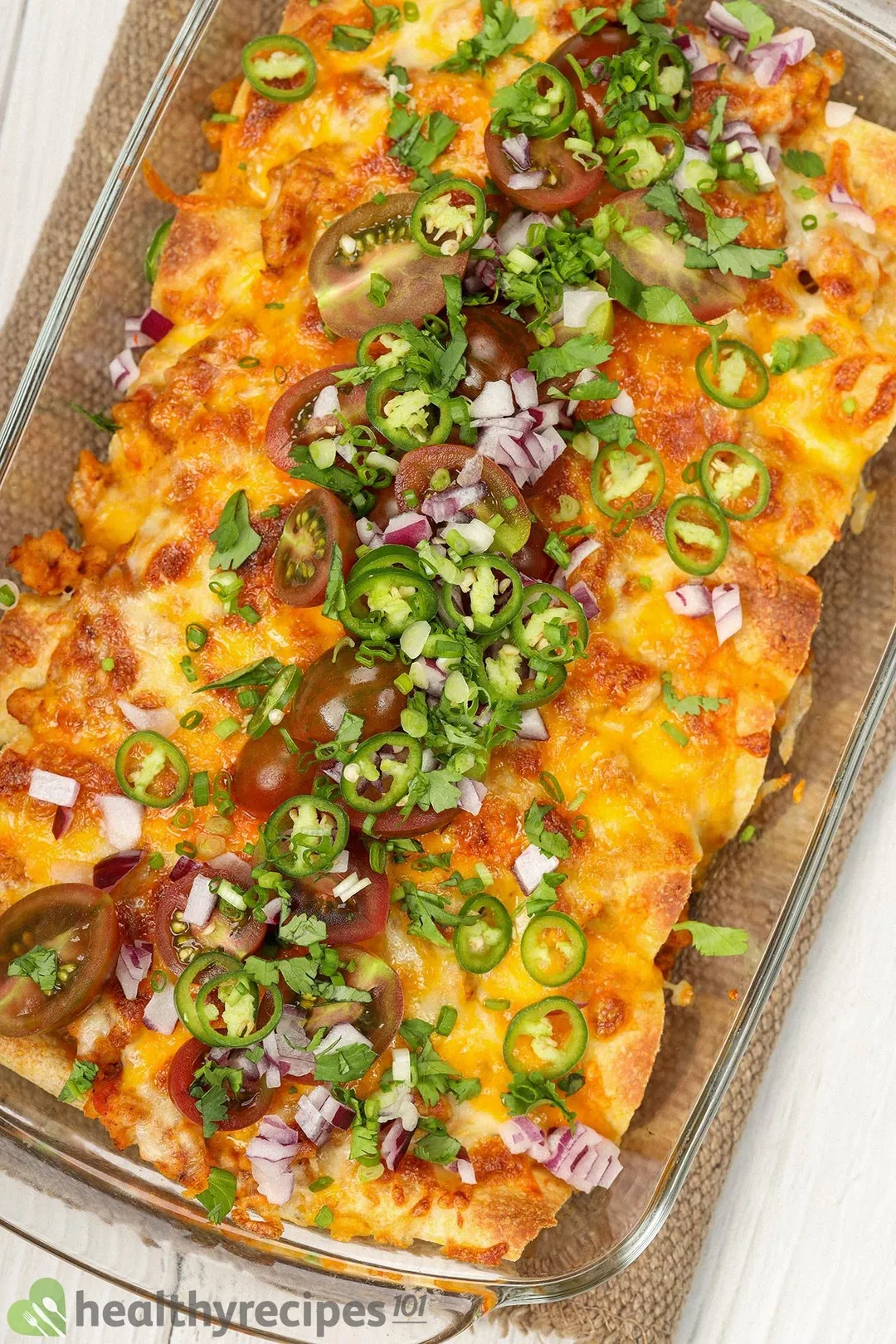 a tray of cooked ground chicken enchilada