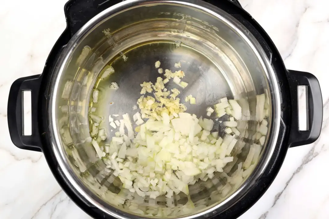 Saute the aromatics Instant Pot Chicken Biryani Recipe