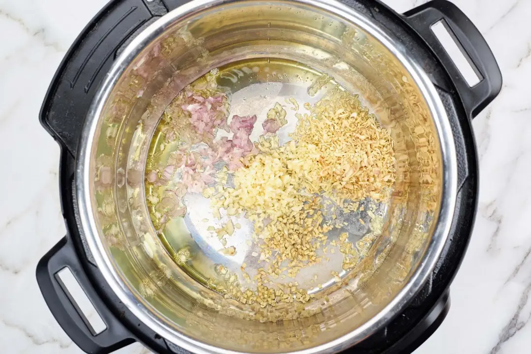 Saute the herbs in oil for instant pot curry