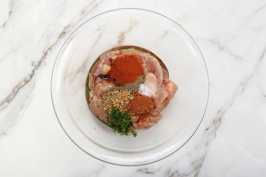 chicken and spice in a glass bowl